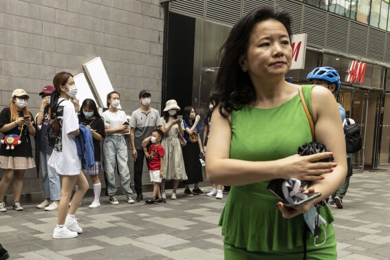 FILE - Cheng Lei, then a Chinese-born Australian journalist for CGTN, the English-language channel of China Central Television, attends a public event in Beijing on Aug. 12, 2020. The Chinese-Australian journalist who worked for China's state broadcaster and was convicted on murky espionage charges has spoken out about the harsh conditions of her detention. (AP Photo/Ng Han Guan, File)