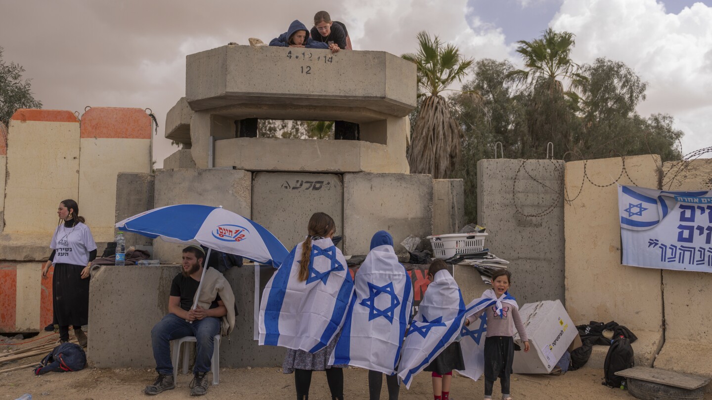 The Latest | Families of hostages held in Gaza launch a 4-day march to demand their freedom