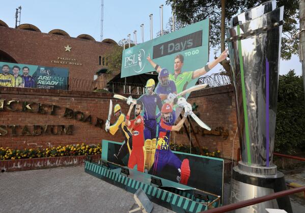 Cutouts of cricket players display outside the Gaddafi Stadium for the upcoming country's premier domestic Twenty20 tournament 'Pakistan Super League' in Lahore, Pakistan, Tuesday, Jan. 25, 2022. The Pakistan Cricket Board says "robust" COVID-19 health and safety protocols are in place ahead of its month-long domestic Twenty20 competition in Karachi and Lahore, with several foreign cricketers participating in a six-team event.(AP Photo/K.M. Chaudary)