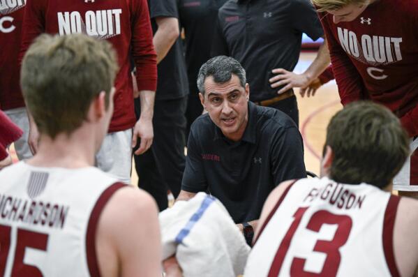 Colgate coach Matt Langel talks to players during the first half against Navy in an NCAA college basketball game for the Patriot League men's tournament championship Wednesday, March 9, 2022, in Hamilton, N.Y., Colgate won 74-58. (AP Photo/Hans Pennink)