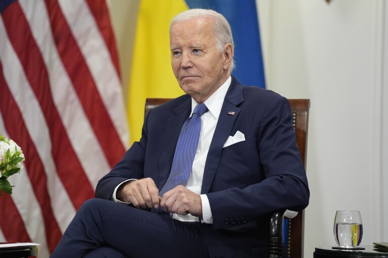 U.S. President Joe Biden looks on as he meets with Ukrainian President Volodymyr Zelenskyy in Paris, Friday, June 7, 2024. (AP Photo/Evan Vucci)