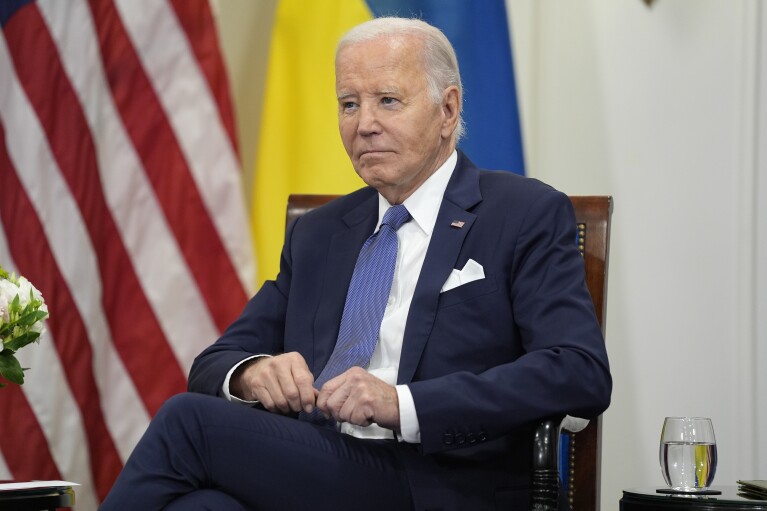 U.S. President Joe Biden looks on as he meets with Ukrainian President Volodymyr Zelensky in Paris, Friday, June 7, 2024. (AP Photo/Evan Vucci)