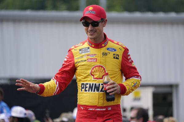 Joey Logano greets fans during driver introductions prior to a NASCAR Cup Series auto race at Richmond Raceway, Sunday, Aug. 14, 2022, in Richmond, Va. (AP Photo/Steve Helber)