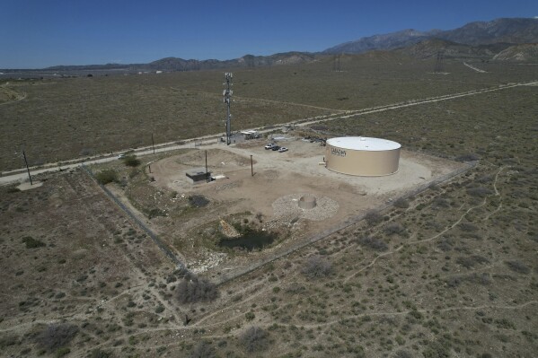 A newly installed Heli-Hydrant, a small, open tank that helicopters can rely on to get water faster for urban fires, sits in Cabazon, Calif., Friday, April 11, 2025. (AP Photo/Brittany Peterson)