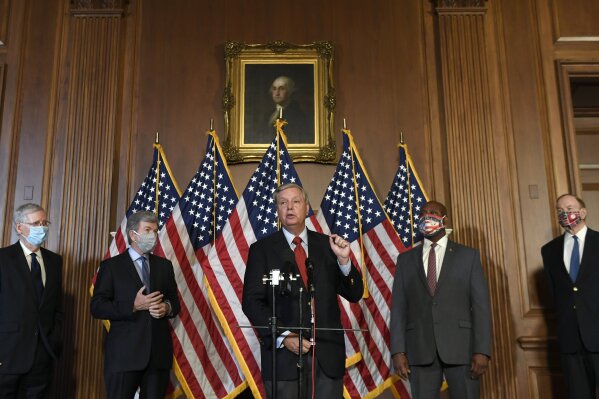 Sen. Lindsey Graham, R-S.C., center, speaks during a news conference on on Capitol Hill in Washington, Monday, July 27, 2020, to highlight the Republican proposal for the next coronavirus stimulus bill. Joining Graham, from left, is Senate Majority Leader Mitch McConnell of Ky., Sen. Roy Blunt, R-Mo., Sent. Tim Scott, R-S.C., and Sen. Richard Shelby, R-Ala. (AP Photo/Susan Walsh)