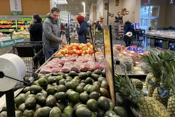 Shoppers pick out items at a grocery store in Glenview, Ill., Saturday, Nov. 19, 2022. On Wednesday the Commerce Department issues its second of three estimates of how the U.S. economy performed in the second quarter of 2022. (AP Photo/Nam Y. Huh, File)
