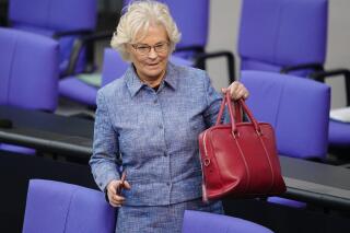Christine Lambrecht, Federal Minister of Defense, takes part in the general debate of the budget week in the Bundestag in Berlin, Germany, Wednesday, June 1, 2022. The Bundestag votes on the 2022 budget in its second deliberation. (Kay Nietfeld/dpa via AP)