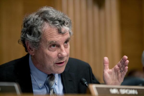 FILE - In this Sept. 10, 2019 file photo, Sen. Sherrod Brown, D-Ohio, speaks before a Senate Banking Committee hearing in Washington. Republican Ohio Gov. Mike DeWine has gotten criticism from within his own party for his aggressive anti-coronavirus measures, but the state's Democratic senator had praise for him Friday, Mary 7, 2021. “I think the governor has had a steady hand in this,” Brown said while visiting the Cincinnati Health Department to promote getting vaccinated against COVID-19.(AP Photo/Andrew Harnik, File)