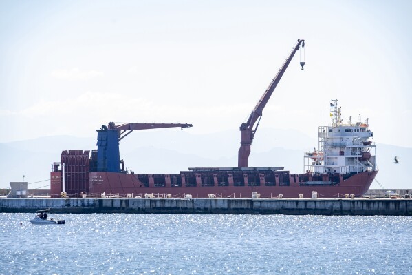 FILE - Russian vessel, Lady R, is docked at the Simon's Town Naval Base near Cape Town, South Africa, Thursday, Dec. 8, 2022. A presidential inquiry in South Africa has found government officials didn't know the U.S.-sanctioned Russian ship, Lady R,was assigned to deliver military equipment to the country until the vessel neared national waters (AP Photo, File)