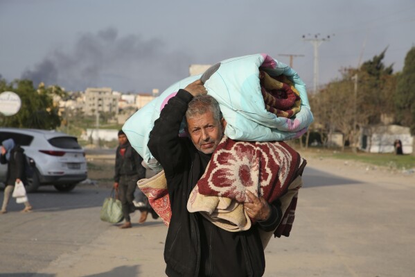 Palestinians fleeing the Israeli offensive on Khan Younis arrive at Rafah, Gaza Strip. Wednesday, Feb. 14, 2024. AP Photo/Hatem Ali)