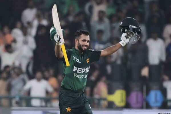 Pakistan's Mohammad Haris celebrates after scoring century during the third Twenty20 cricket match between Pakistan and Bangladesh, in Lahore, Pakistan, Sunday, June 1, 2025. (AP Photo/K.M. Chaudary)