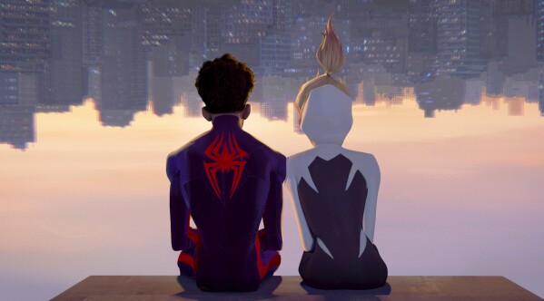 This image released by Sony Pictures Animation shows Miles Morales as Spider-Man, voiced by Shameik Moore, left, and and Spider-Gwen, voiced by Hailee Steinfeld, in a scene from Columbia Pictures and Sony Pictures Animation's "Spider-Man: Across the Spider-Verse." (Sony Pictures Animation via AP)