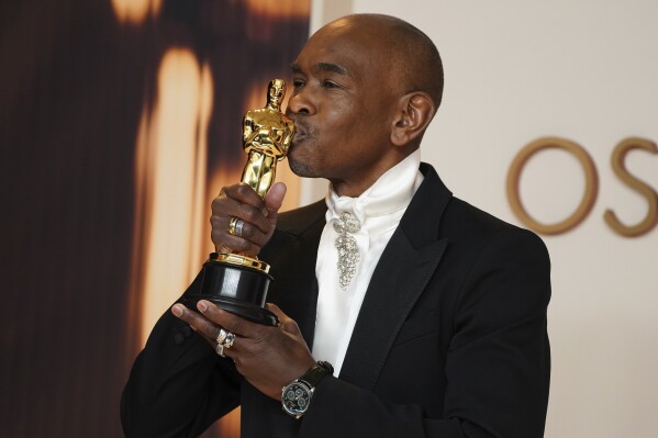 Paul Tazewell, winner of the award for best costume design for "Wicked," poses in the press room at the Oscars on Sunday, March 2, 2025, at the Dolby Theatre in Los Angeles. (Photo by Jordan Strauss/Invision/AP)
