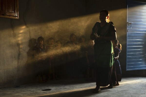 Congregants attend an Indigenous blessing ceremony for communion wafers that will be taken to a priest to be consecrated in the Simojovel municipality, Mexico, April 26, 2025. (AP Photo/Isabel Mateos)