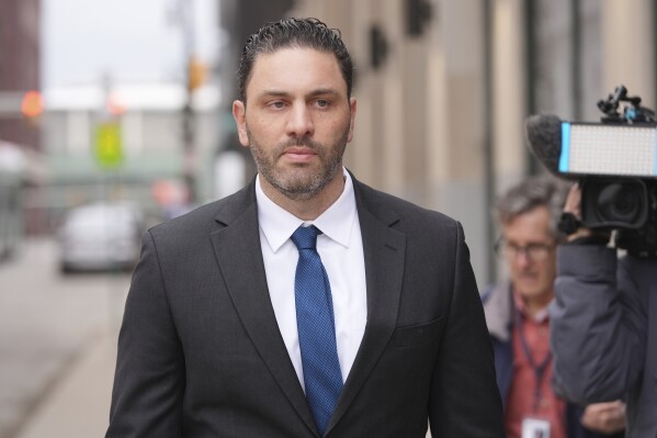 Former NFL and University of Michigan assistant football coach Matt Weiss leaves federal court in Detroit, Monday, March 24, 2025. (AP Photo/Paul Sancya)
