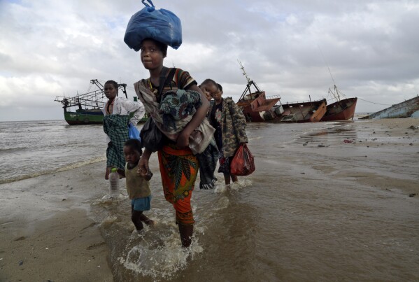 FILE — Displaced families arrive after being rescued by boat from a flooded area of Buzi district, 200 kilometers (120 miles) outside Beira, Mozambique, Saturday, March 23, 2019. Much of the world takes daily weather forecasts for granted. But most of Africa's 1.3 billion people live with little advance knowledge of what's to come. That can be deadly, with damage running in the billions of dollars. The first Africa Climate Summit opens this week in Kenya to highlight the continent that will suffer the most from climate change while contributing to it the least. At the heart of every issue on the agenda, from energy to agriculture, is the lack of data collection that drives decisions as basic as when to plant and when to flee. (AP Photo/Tsvangirayi Mukwazhi, File)