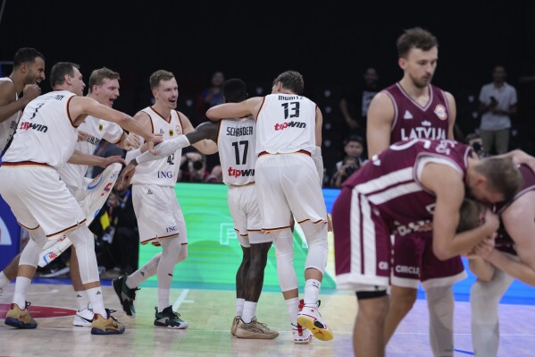 Germany celebrates after defeating Latvia in their Basketball World Cup quarterfinal in Manila, Philippines, Wednesday, Sept. 6, 2023. (AP Photo/Michael Conroy)
