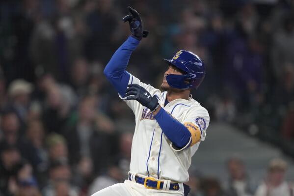 Seattle Mariners' Julio Rodriguez gestures after crossing the plate after he hit a solo home run against the Oakland Athletics during the first inning of a baseball game, Sunday, July 3, 2022, in Seattle. (AP Photo/Ted S. Warren)
