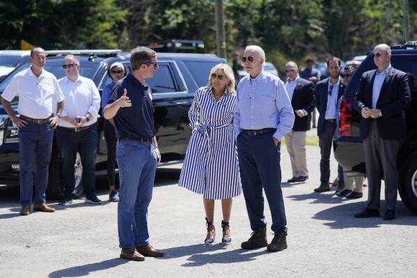 President Joe Biden and first lady Jill Biden, talk with Kentucky Gov. Andy Beshear, as they view flood damage, Monday, Aug. 8, 2022, in Lost Creek, Ky. (AP Photo/Evan Vucci)