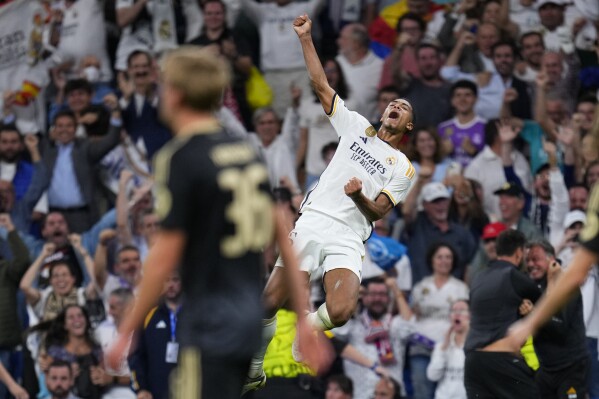 Real Madrid's Jude Bellingham celebrates after scoring his side's first goal during the Champions League group C soccer match between Real Madrid and FC Union Berlin at the Santiago Bernabeu stadium in Madrid, Wednesday, Sept. 20, 2023. (AP Photo/Manu Fernandez)