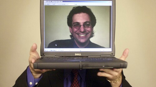 FILE - Computer hacker turned author Kevin Mitnick poses for a portrait Thursday, June 27, 2002, in Las Vegas. Mitnick, whose pioneering antics tricking employees in the 1980s and 1990s into helping him steal software and services from big phone and tech companies made him the most celebrated U.S. hacker, has died at age 59. (AP Photo/Joe Cavaretta, File)