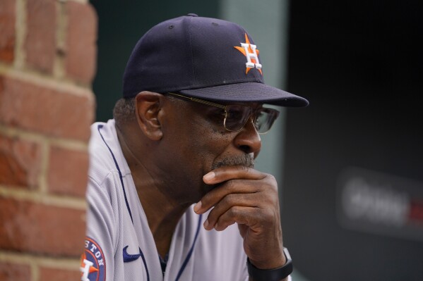 FILE - Houston Astros manager Dusty Baker Jr. looks on from the dugout in the third inning of a baseball game against the Baltimore Orioles, Thursday, Aug. 10, 2023, in Baltimore. Dusty Baker usually by now is starting to think about getting some rest for his everyday players and setting up his pitching rotation for the playoffs. Not yet this year in what is shaping up for a wild West finish in the American League.(AP Photo/Julio Cortez, File)