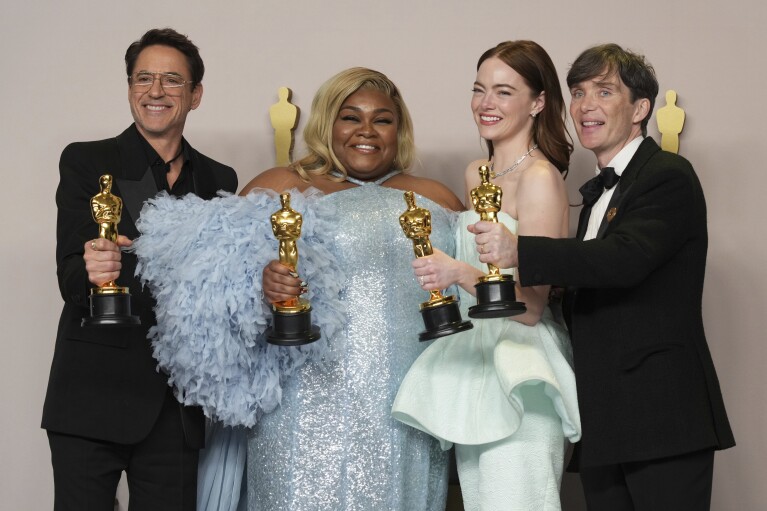 Robert Downey Jr., from left, Da'Vine Joy Randolph, Emma Stone, and Cillian Murphy, pose in the press room at the Oscars on Sunday, March 10, 2024, at the Dolby Theatre in Los Angeles. (Photo by Jordan Strauss/Invision/AP)