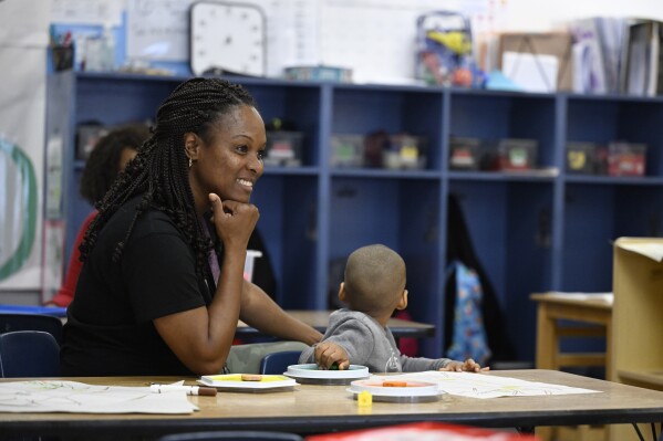 Teacher Vanessa Simmons works with children at a Head Start program at Alliance for Community Empowerment, Thursday, Sept. 28, 2023, in Bridgeport, Conn. Head Start programs serving more than 10,000 disadvantaged children would immediately lose federal funding if there is a federal shutdown, although they might be able to stave off immediate closure if it doesn't last long. (AP Photo/Jessica Hill)