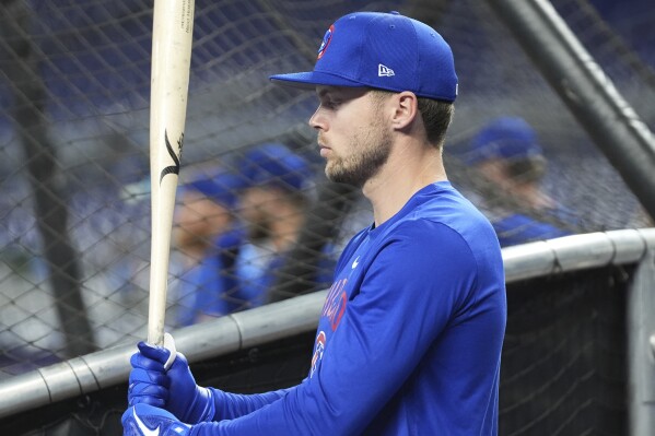 Chicago Cubs left fielder Ian Happ takes batting practice after returning from the 10-day injured list before a baseball game against the Miami Marlins, Tuesday, May 20, 2025, in Miami. (AP Photo/Lynne Sladky)