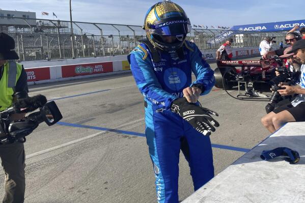 Jimmie Johnson prepares for practice at the Grand Prix of Long Beach, Calif., on Saturday, April 9, 2022. Johnson fractured his hand in a crash on Friday and was fitted with a carbon fiber splint that he tested in Saturday practice. (AP Photo/Jenna Fryer)