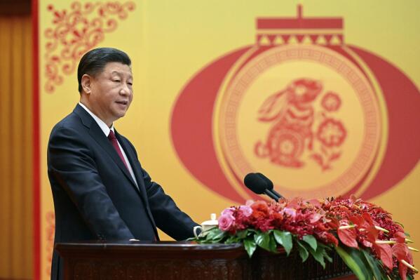 FILE - In this photo released by Xinhua News Agency, Chinese President Xi Jinping delivers a speech for a Spring Festival reception the Great Hall of the People in Beijing on Jan. 20, 2023. China has ordered closer adherence to the dictates of the ruling Communist Party and leader Xi Jinping in legal education, demanding that schools “oppose and resist Western erroneous views” such as constitutional government, separation of powers, and independence of the judiciary. (Li Xueren/Xinhua via AP, File)
