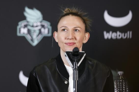 FILE - New York Liberty guard Courtney Vandersloot looks on during a news conference, Thursday, Feb. 9, 2023, in New York. Vandersloot wasn't sure whether she wanted to come to New York this season to play and solidify the incredible team that the Liberty were building. Coming to New York though would mean she'd be far away from her mom, Jan, who was diagnosed with advanced multiple myeloma cancer last July. (AP Photo/Jessie Alcheh, File)