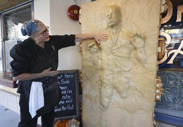 Catherine Pervan, with Our House Bakery in Benicia, Calif., talks about creating the life-sized Han Solo on Oct. 13, 2022  The piece is the bakery's entry in the downtown Benicia scarecrow contest. (Chris Riley/The Times-Herald via AP)