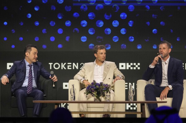 Eric Trump, Executive VP of The Trump Organization, from right, speaks as Co-founder of World Liberty Financial Zach Witkoff and Founder of TRON Justin Sun look on during Token 2049, a Crypto event, in Dubai, United Arab Emirates, May 1, 2025. (AP Photo/Altaf Qadri, File)