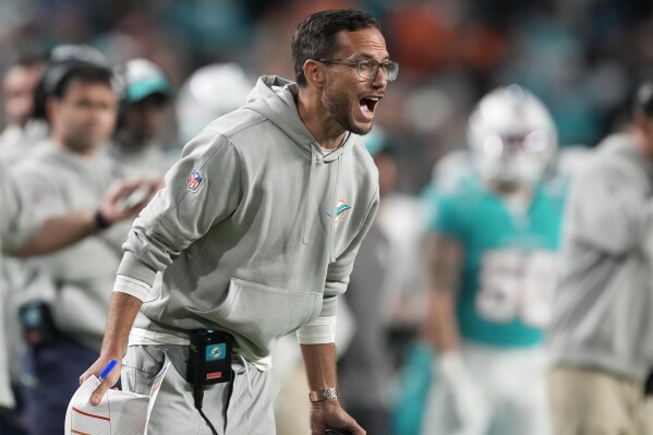 Miami Dolphins head coach Mike McDaniel reacts from the sidelines during the second half of an NFL football game against the Tennessee Titans, Monday, Dec. 11, 2023, in Miami. (AP Photo/Rebecca Blackwell)