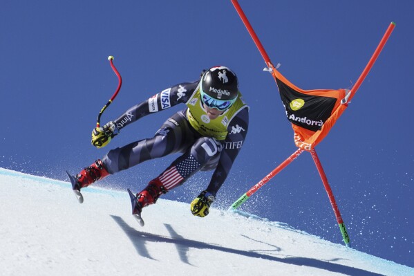 FILE - United States' Breezy Johnson speeds down the course during an alpine ski, women's World Cup downhill in Soldeu, Andorra, on March 15, 2023. Downhill skier Breezy Johnson has been banned for 14 months for three violations of anti-doping rules and can return to race in December. The U.S. Anti-Doping Agency has published its decision for Johnson’s failure to comply with so-called “whereabouts” rules. (AP Photo/Giovanni Zenoni, File)