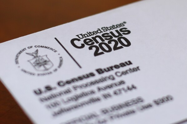 ADD MORE LOCATIONS FILE - An envelope containing a 2020 census letter mailed to a U.S. resident is seen, April 5, 2020, in Detroit. The U.S. Census Bureau on Monday, July 22, 2024, picked six locations for full-scale dress rehearsals to practice for the next U.S. head count in 2030, the largest peacetime mobilization in the U.S. which helps determine political power and the distribution of federal funds. (AP Photo/Paul Sancya, File)