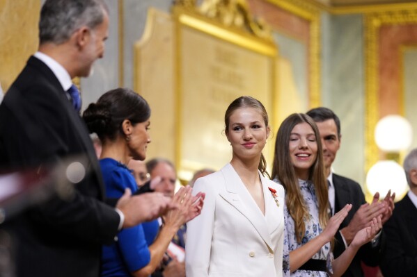 Princess Leonor, center, receives the applause of Spanish King Felipe VI, Queen Letizia and her sister Sofia, right, after swearing allegiance to the Constitution during a gala event that makes her eligible to be queen one day, in Madrid on Tuesday, Oct. 31 2023. The heir to the Spanish throne, Princess Leonor, is to swear allegiance to the Constitution on her 18th birthday Tuesday, in a gala event that paves the way to her becoming queen when the time comes. Leonor is the eldest daughter of King Felipe and Queen Letizia. (AP Photo/Manu Fernandez)