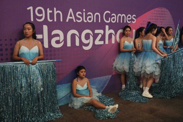 Performers wait for the opening ceremony of the 19th Asian Games in Hangzhou, China, Saturday, Sept. 23, 2023. (AP Photo/Vincent Thian)