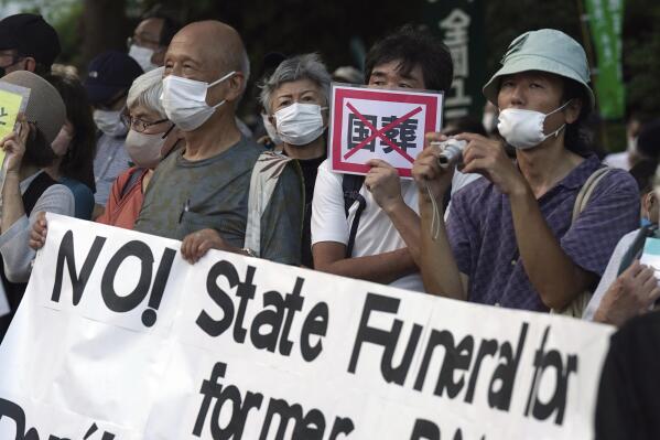 FILE - People protest outside Diet against the state paying for Japan's former Prime Minister Shinzo Abe's funeral in Tokyo on Aug. 31, 2022. A rare state funeral Tuesday, Sept. 27 for the former prime minister who was assassinated in July, has split Japan. (AP Photo/Eugene Hoshiko, File)