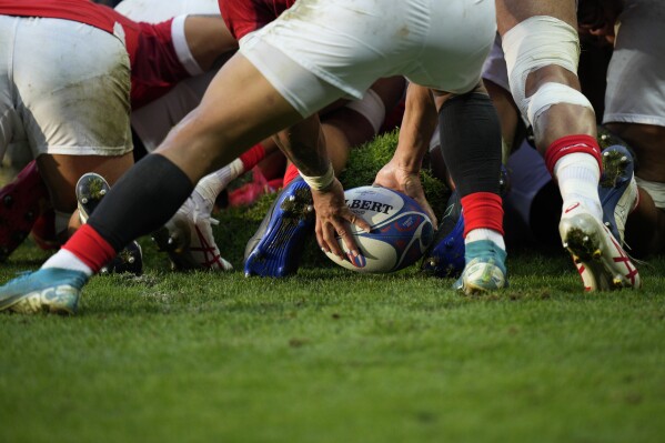 Tonga's Augustine Pulu prepares to pass the ball during the Rugby World Cup Pool B match between Scotland and Tonga at the Stade de Nice, in Nice, France, Sunday, Sept. 24, 2023. (AP Photo/Daniel Cole)