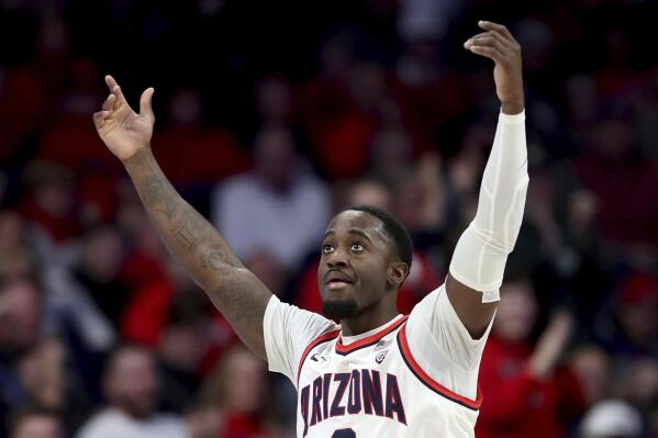 Arizona guard Courtney Ramey (0) gestures for more noise as his team builds a lead against Utah in the first half of an NCAA college basketball game in, Tucson, Ariz., Feb. 16, 2023. (Kelly Presnell/Arizona Daily Star via AP)