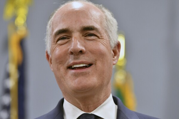 Sen. Bob Casey, D-Pa., smiles while speaking during an event at AFSCME Council 13 offices, March 14, 2024, in Harrisburg, Pa. For Democrats trying to defend the White House and Senate majority, Casey is emerging as the tip of the spear in trying to reframe the election-year narrative around inflation, a key soft spot in 2024 for Democrats on the all-important voter issue of the economy. (AP Photo/Marc Levy)