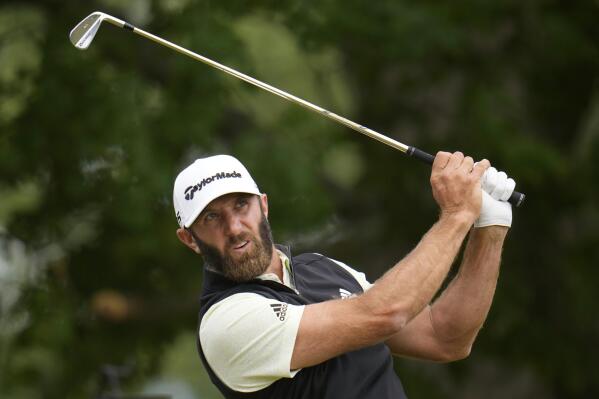 Dustin Johnson watches his shot on the sixth hole during the third round of the U.S. Open golf tournament at The Country Club, Saturday, June 18, 2022, in Brookline, Mass. (AP Photo/Julio Cortez)