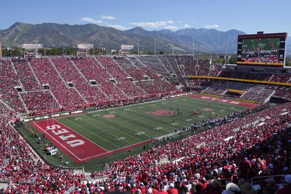 FILE - Weber State and Utah play during an NCAA college football game Rice-Eccles Stadium on Sept. 16, 2023, in Salt Lake City. College athletes in Utah who are looking to profit off their name, image and likeness will have to seek written approval from their school for any business deal exceeding $600 under a bill that received final legislative approval Friday, March 1, 2024, in the state Senate. (APPhoto/Rick Bowmer, File)