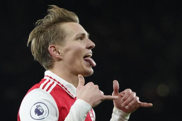 Arsenal's Martin Odegaard celebrates after scoring his side's third goal during the English Premier League soccer match between Arsenal and Everton at the Emirates stadium in London, Wednesday, March 1, 2023. (AP Photo/Kirsty Wigglesworth)