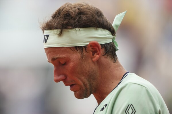 Norway's Casper Ruud looks down as he plays Portugal's Nuno Borges during their second round match of the French Tennis Open, at the Roland-Garros stadium, in Paris, Wednesday, May 28, 2025. (AP Photo/Lindsey Wasson)
