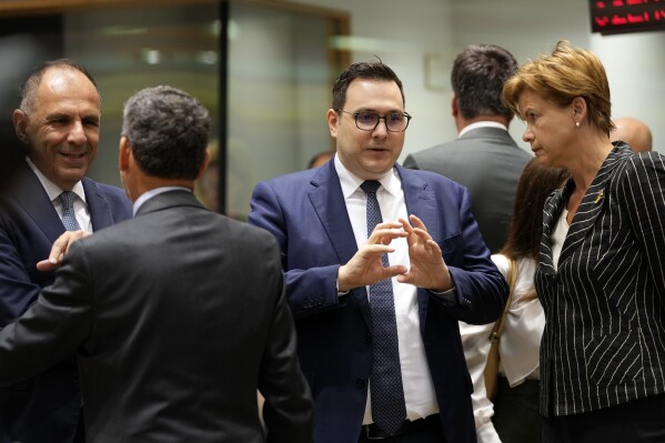 Czech Republic's Foreign Minister Jan Lipavsky, second right, speaks with Latvia's Foreign Minister Baiba Braze during a meeting of EU foreign ministers at the European Council building in Brussels, Thursday, Aug. 29, 2024. (AP Photo/Virginia Mayo)
