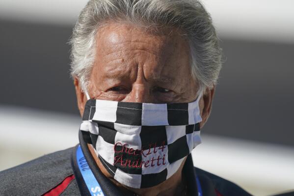 FILE - In this Aug. 21, 2020, file photo, Mario Andretti looks on before the final practice session for the Indianapolis 500 auto race at Indianapolis Motor Speedway. Andretti feels the same pain as so many others these days. His wife died two years ago, long before the pandemic. And his beloved nephew lost a brutal battle with colon cancer. But then COVID-19 claimed his twin brother and one of the greatest racers of all time is not immune from the loneliness and depression sweeping the world. (AP Photo/Darron Cummings, File)