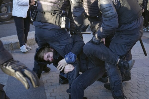 FILE - Russian policemen detain a demonstrator protesting mobilization in St. Petersburg, Russia, Saturday, Sept. 24, 2022. (AP Photo, File)